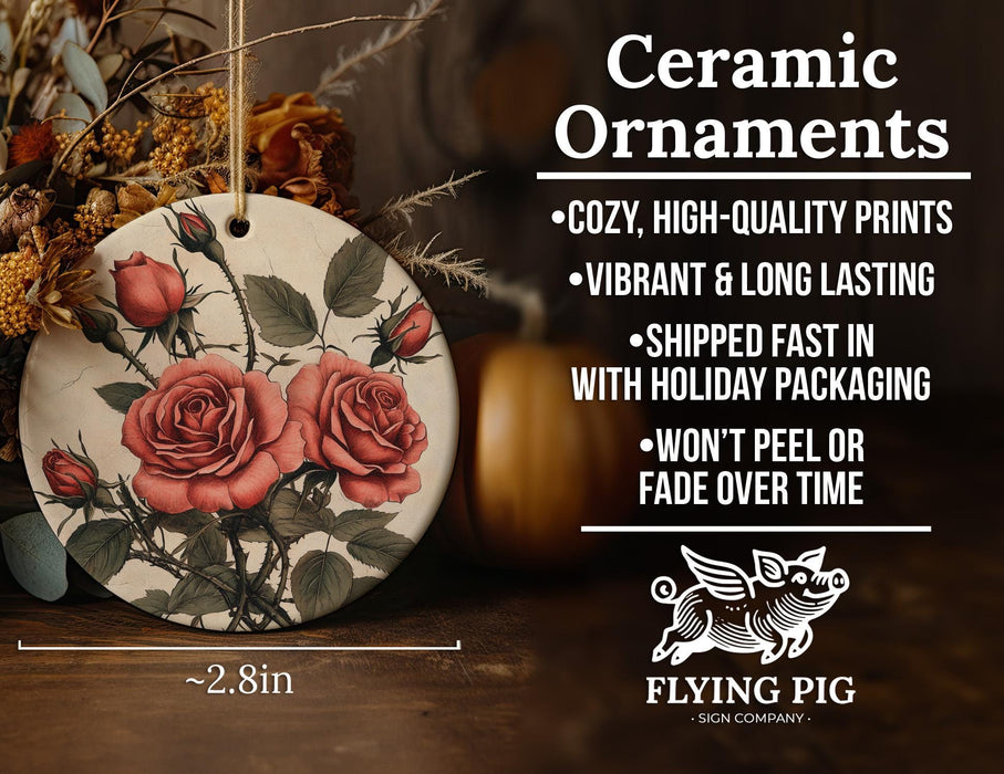 a ceramic ornament with roses painted on it