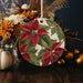 a christmas ornament hanging from a wooden table