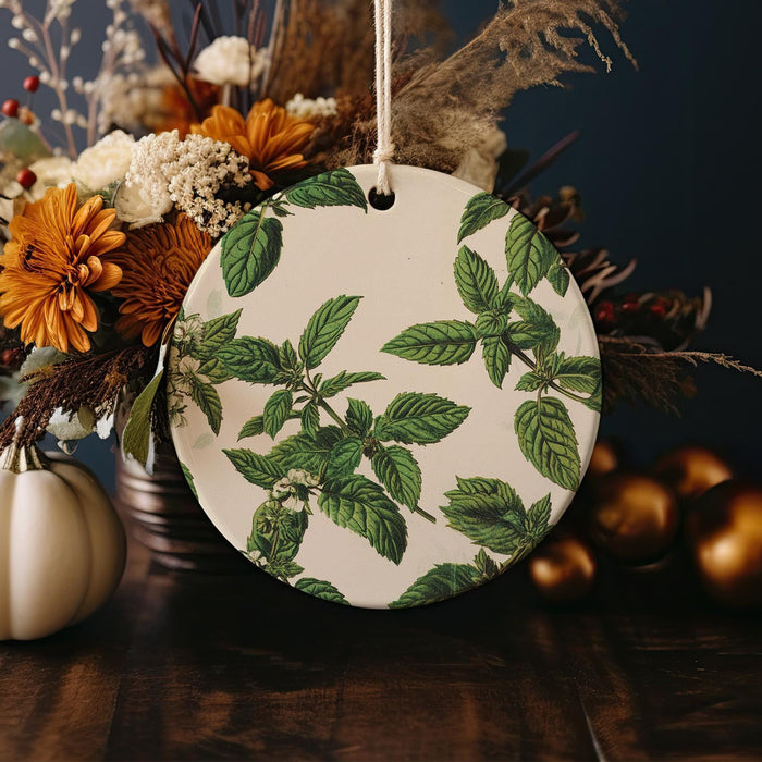 a white plate with a green leaf design on it