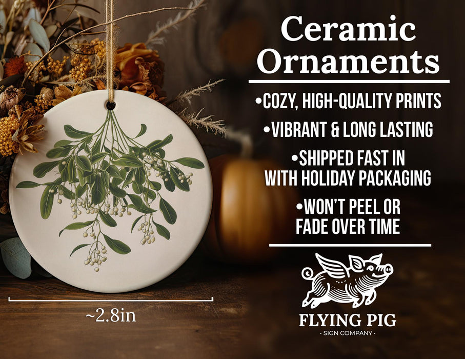 a ceramic ornament with a green plant on it