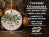 a ceramic ornament with a green plant on it