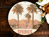 a palm tree sign on a wooden wall