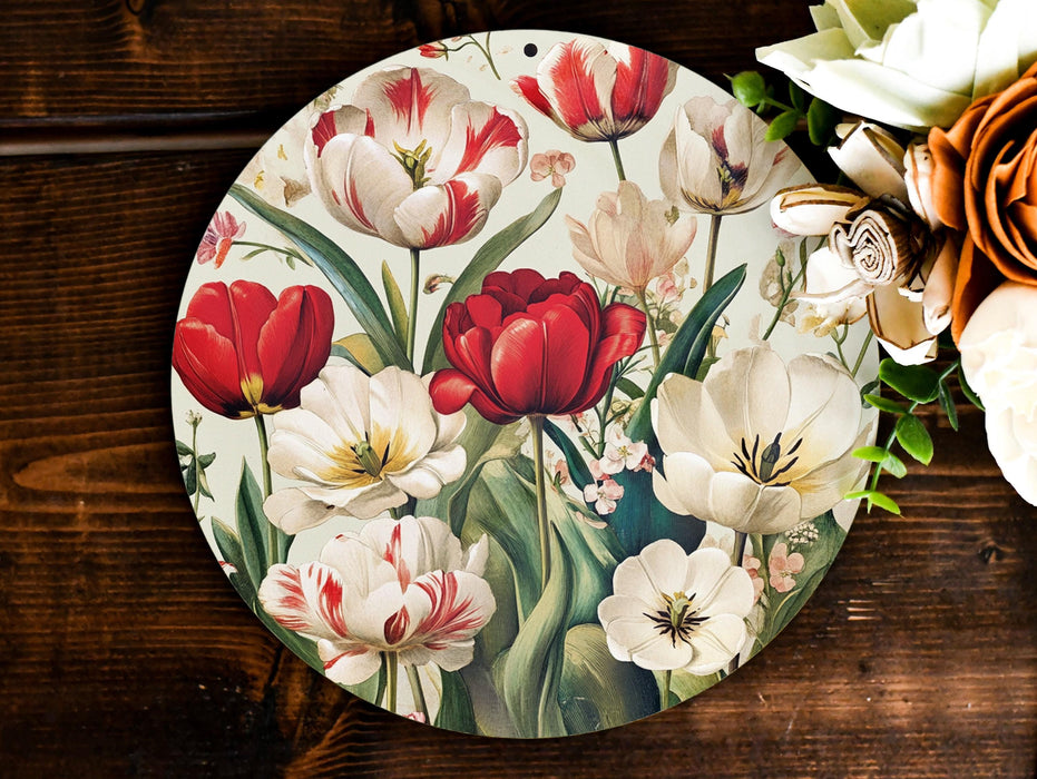 a plate with flowers painted on it next to a bouquet of flowers