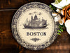 a plate with a picture of boston on it