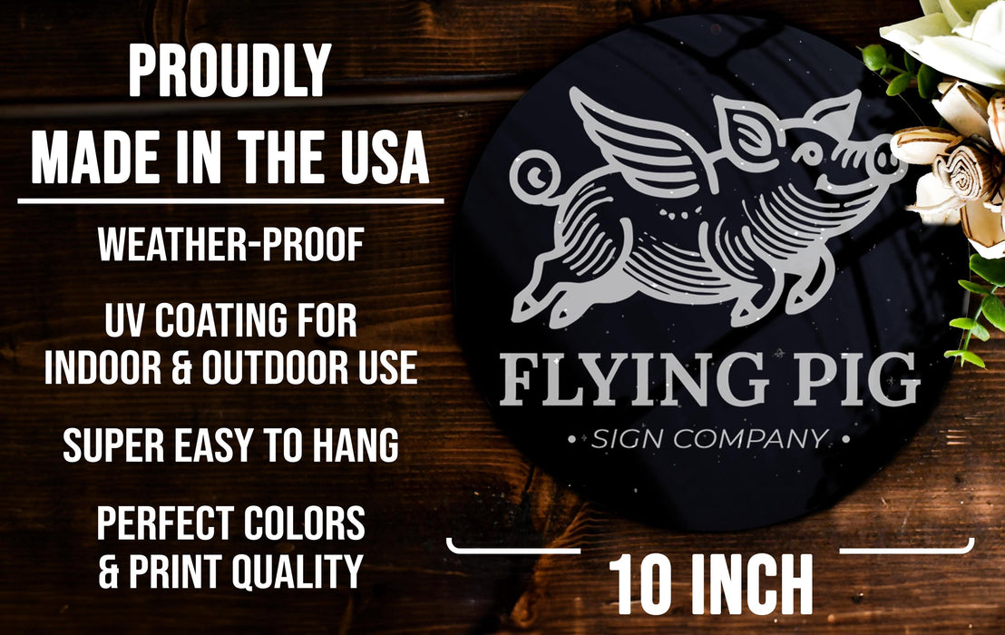 a flying pig sign on a wooden table