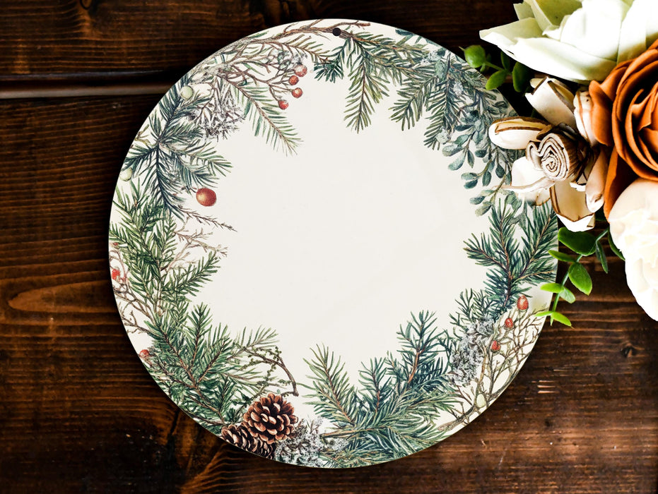 a white and green plate with a pine cone on it