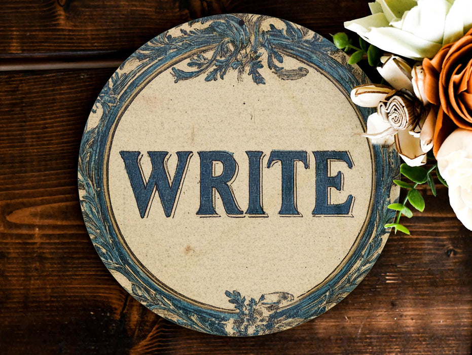 a sign that says write on it next to flowers