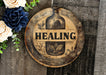 a wooden sign that says, healing on it