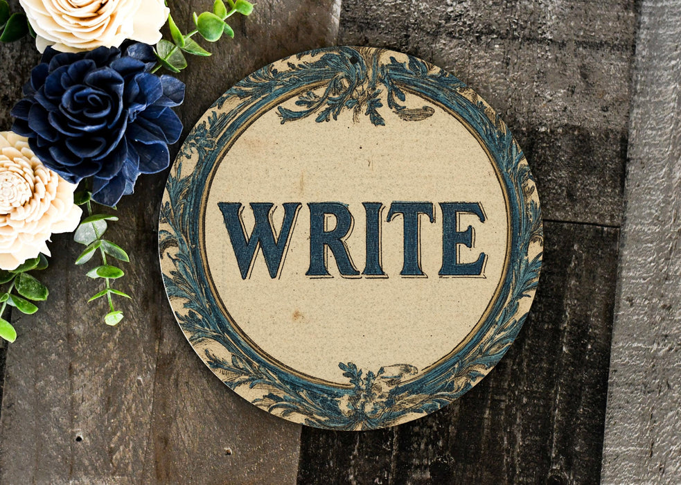 a sign that says write on it next to flowers
