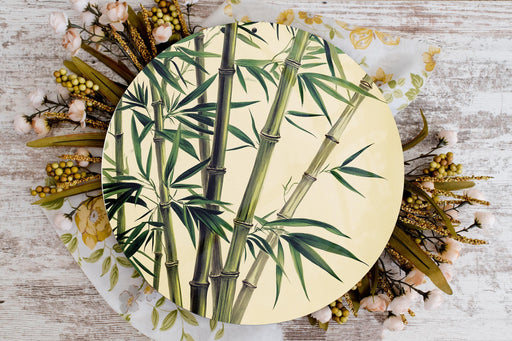 a plate with a painting of a bamboo tree on it