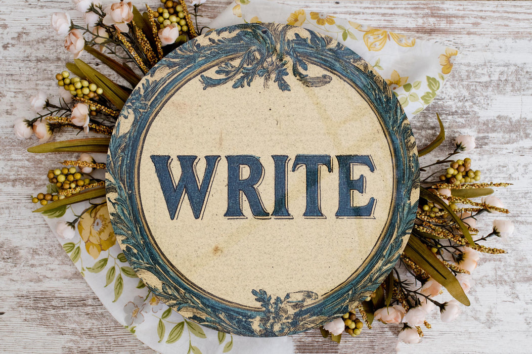 a white plate topped with flowers and writing