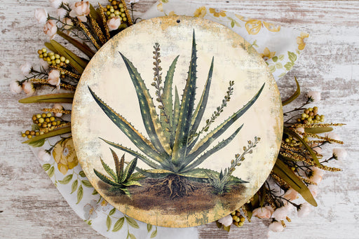 a plate with a painting of a plant on it