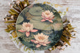 a plate with a painting of water lilies on it