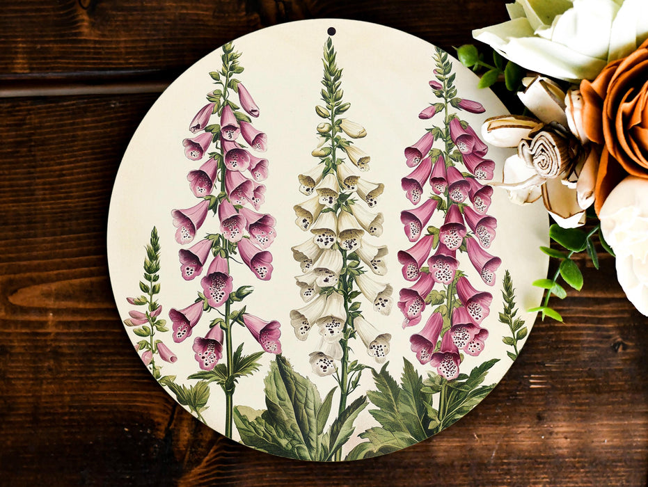 a plate with flowers painted on it next to a bouquet of flowers