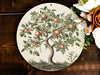 a picture of an apple tree on a plate