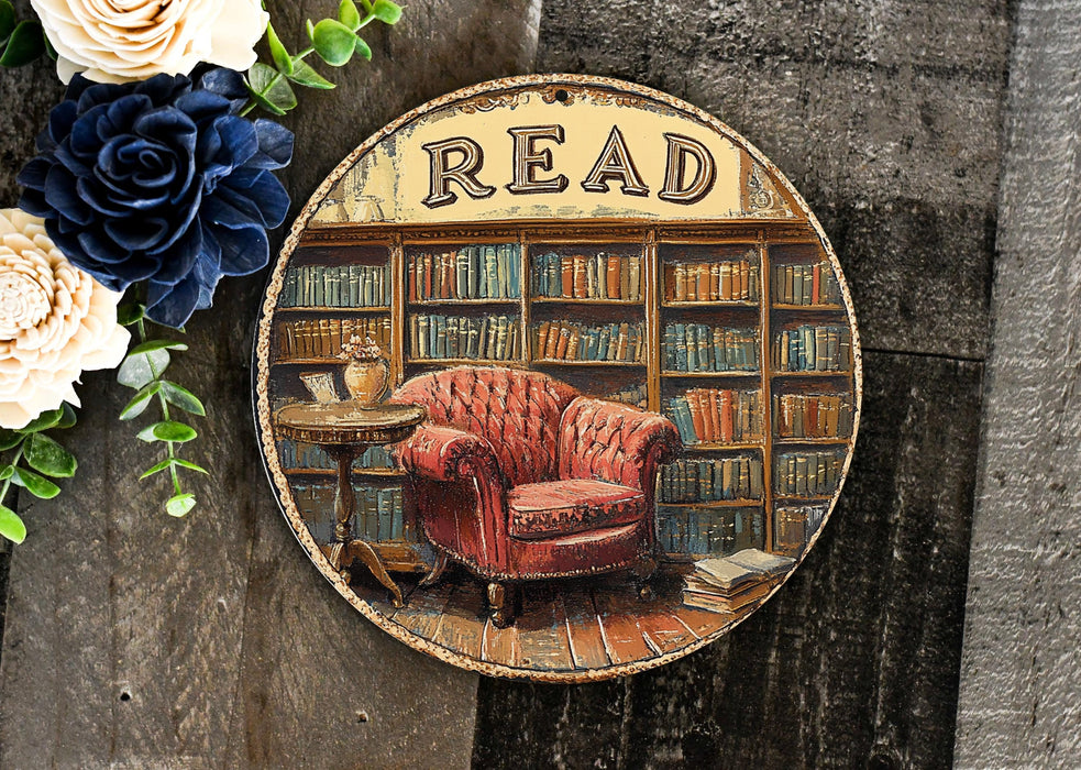 a picture of a red chair in front of a bookshelf