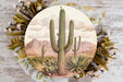 a plate with a painting of a cactus on it