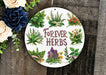 a sign that says forever herbs next to flowers
