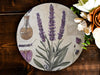 a plate with flowers and a bottle on it