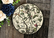 a white plate with a floral design on it