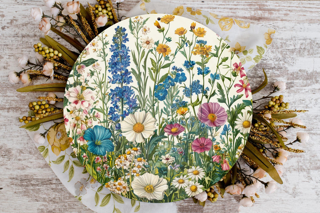 a plate with flowers painted on it sitting on a table