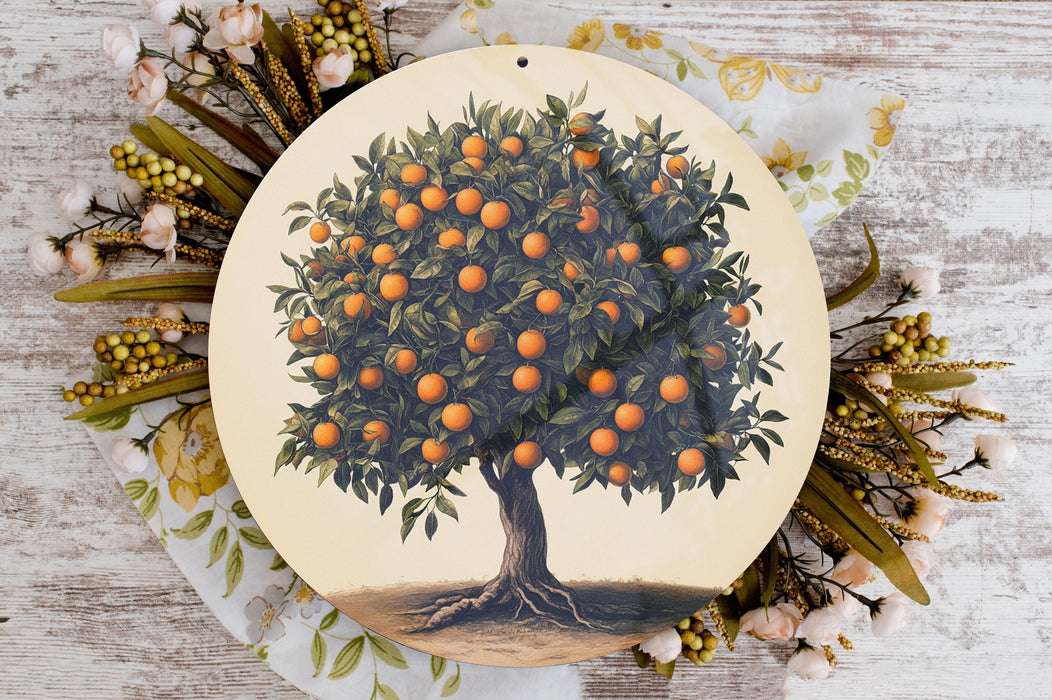 a plate with an orange tree painted on it
