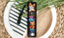 a picture of a cat bookmark on a plate