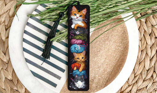 a picture of a cat bookmark on a plate