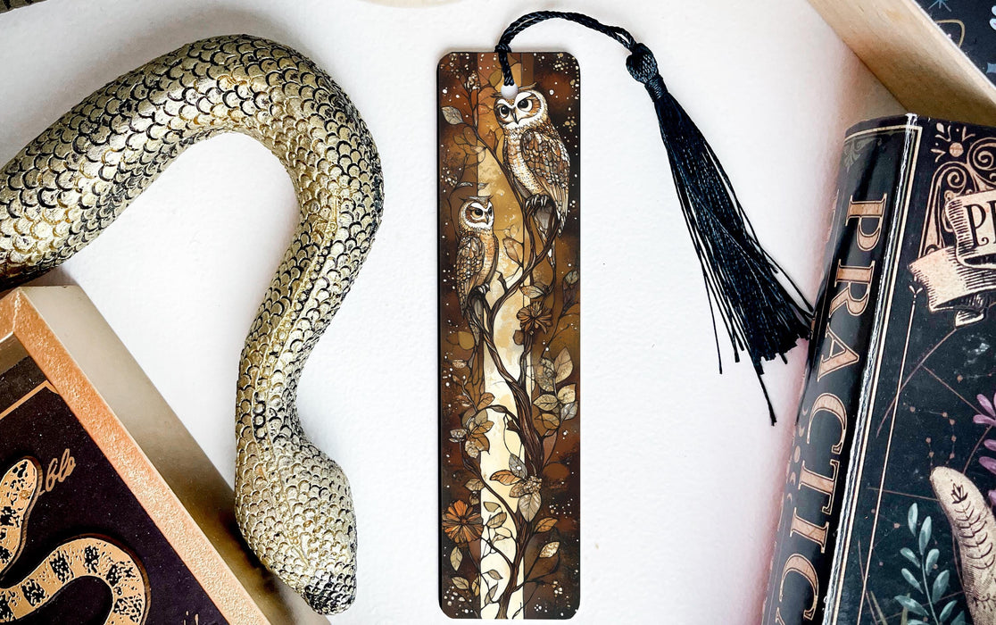 a snake, bookmarks, and other items on a table