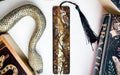 a snake, bookmarks, and other items on a table