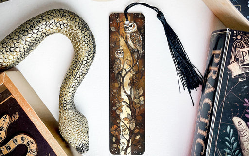 a snake, bookmarks, and other items on a table