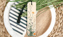 a close up of a plate of food with a bookmark