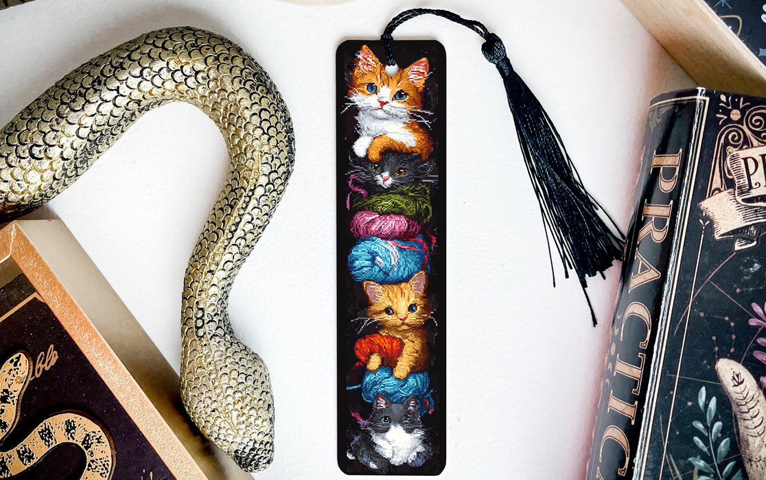 a bookmark with a picture of cats on it