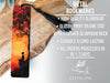 a bookmark with a picture of a boy sitting on a tree