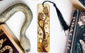 a bookmark, snake, and other books on a table