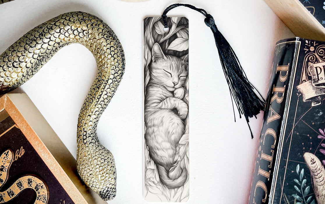 a bookmark with a picture of a cat and a snake on it