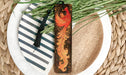 a decorative bookmark with a bird painted on it