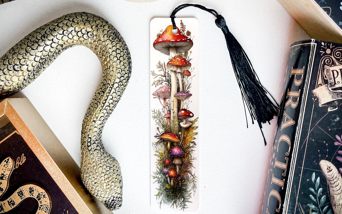a bookmark with a picture of mushrooms and a snake on it