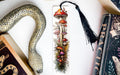 a bookmark with a picture of mushrooms and a snake on it