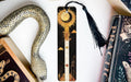 a bookmark with a snake and a book on it