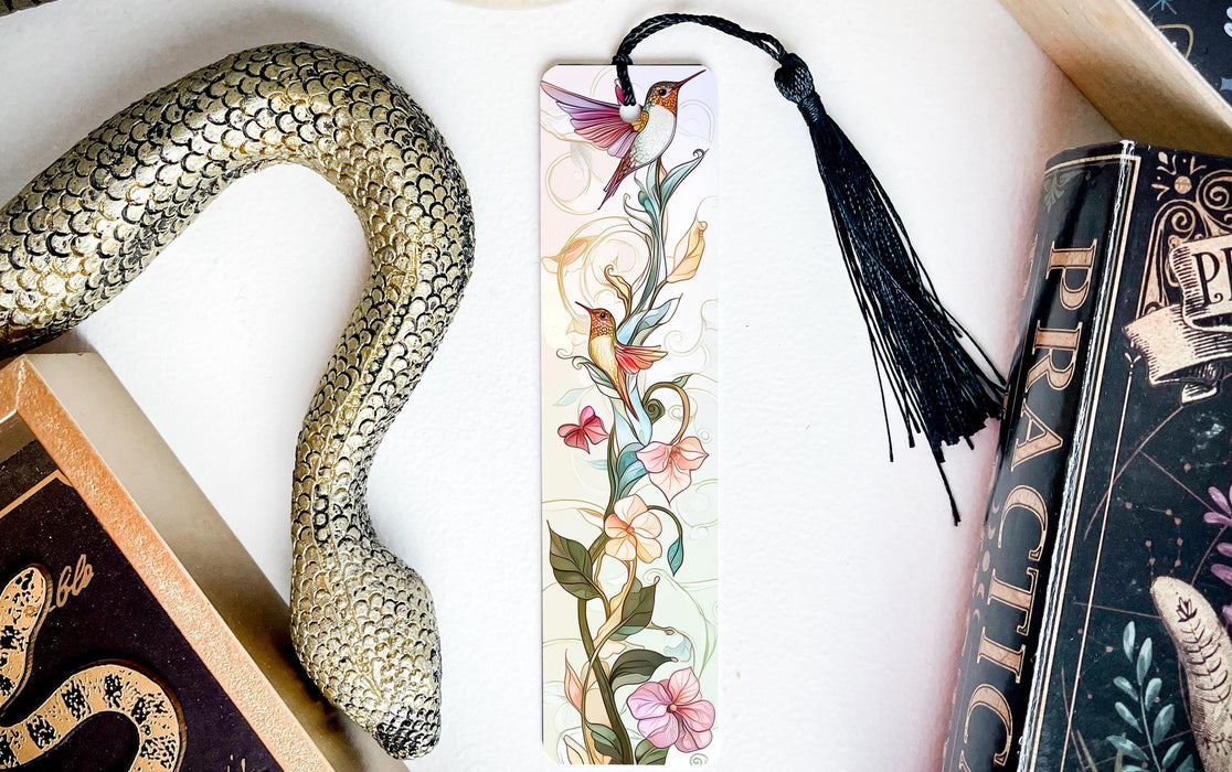 a snake, a bookmark, and some books on a table