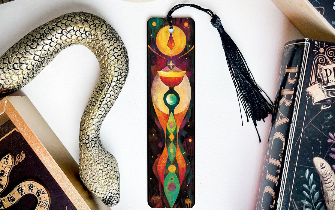 a bookmark with a snake and a book on it