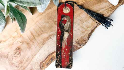 a red bookmark with a picture of a woman kissing a man