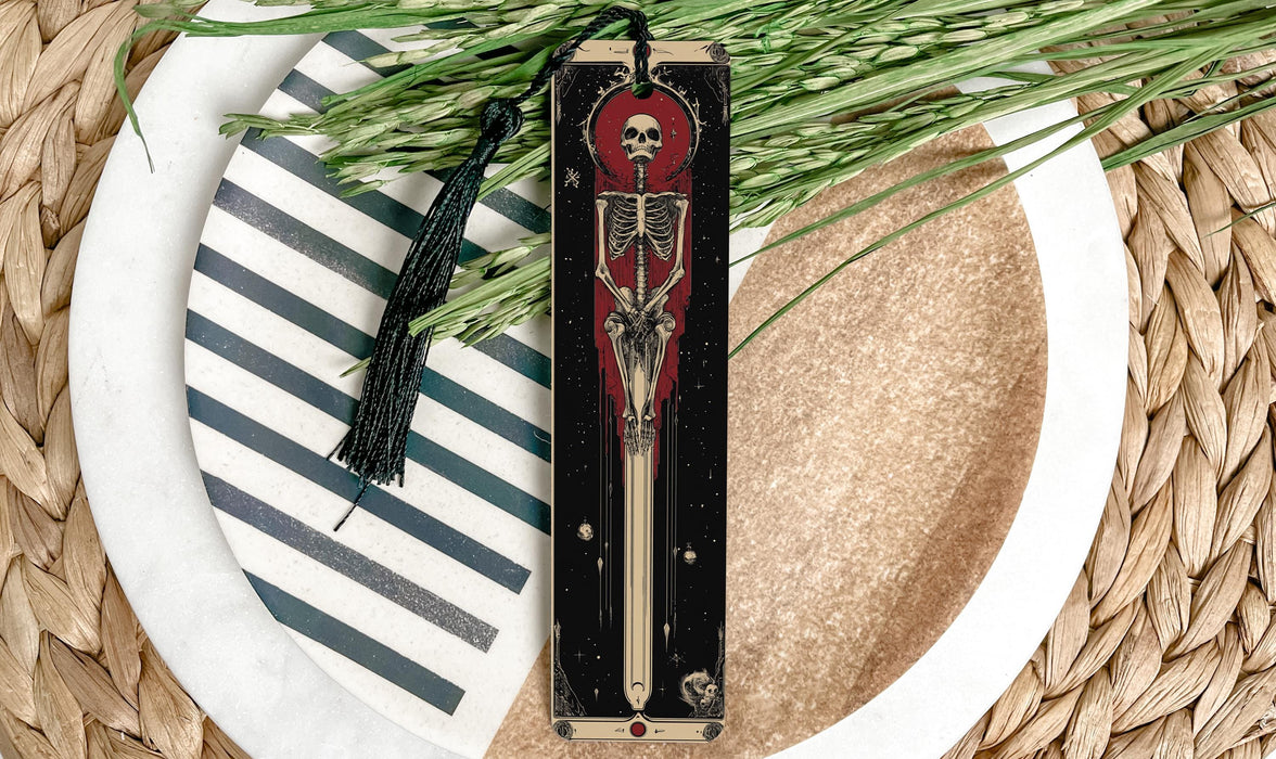 a knife with a skeleton on it sitting on a plate