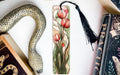 a snake, a bookmark, and some books on a table