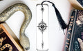 a snake, a bookmark, and some books on a table