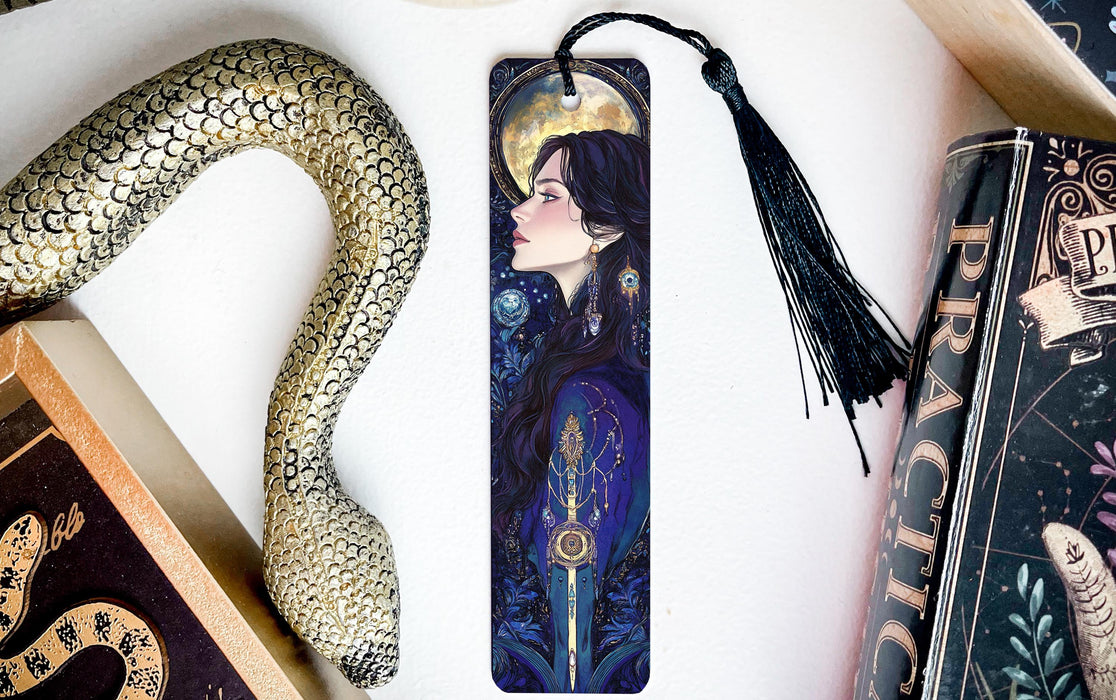 a bookmark with a picture of a woman and a snake on it