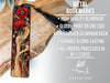 a metal bookmark with a red flower on it