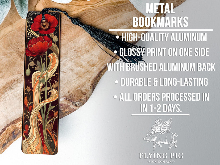 a metal bookmark with a red flower on it