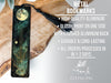 a bookmark with an image of a tree and a full moon